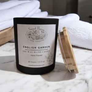 Soy and beeswax blended all natural candle with eco-friendly cloth wicks. Smells like an English Garden on a breezy summer day. High-quality black matte glass and wooden top.