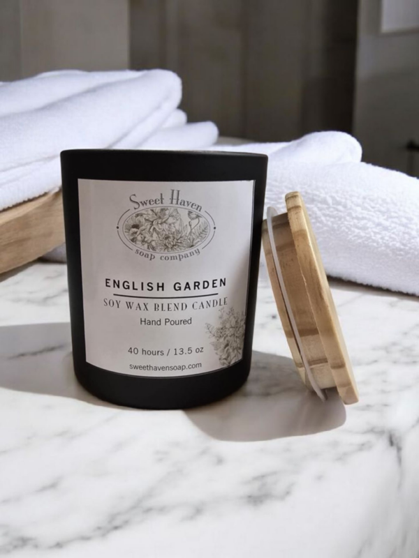 Soy and beeswax blended all natural candle with eco-friendly cloth wicks. Smells like an English Garden on a breezy summer day. High-quality black matte glass and wooden top.